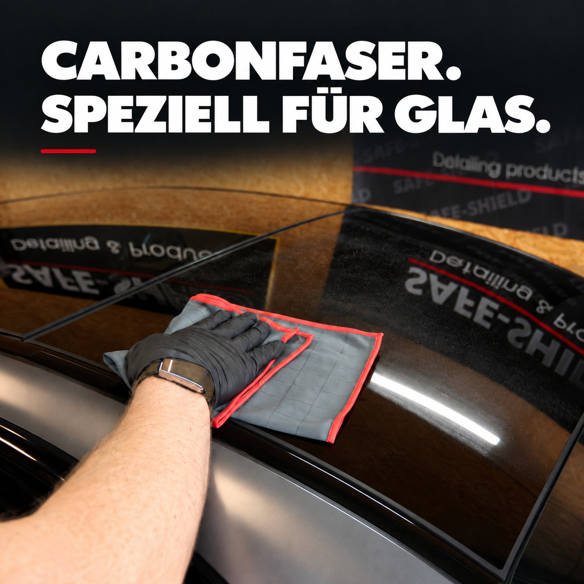 Grey Carbon microfibre cloth with a red edge used for glass cleaning, with carbon fibre specifically for glass.