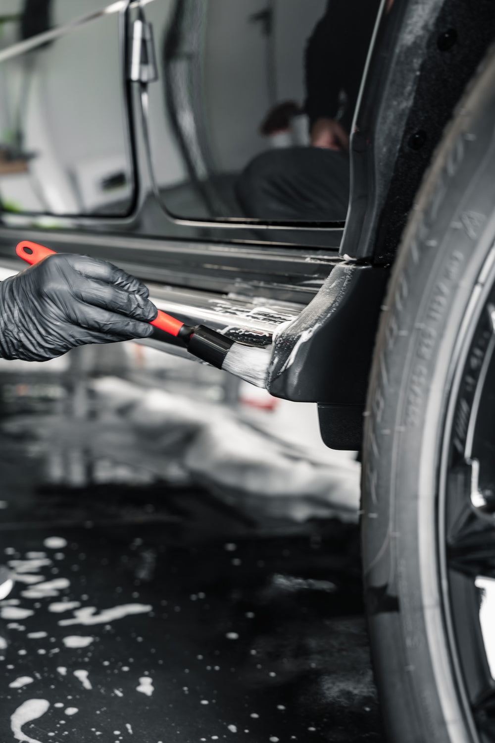 Grey Allround Detailing Brush cleaning a foamed vehicle sill