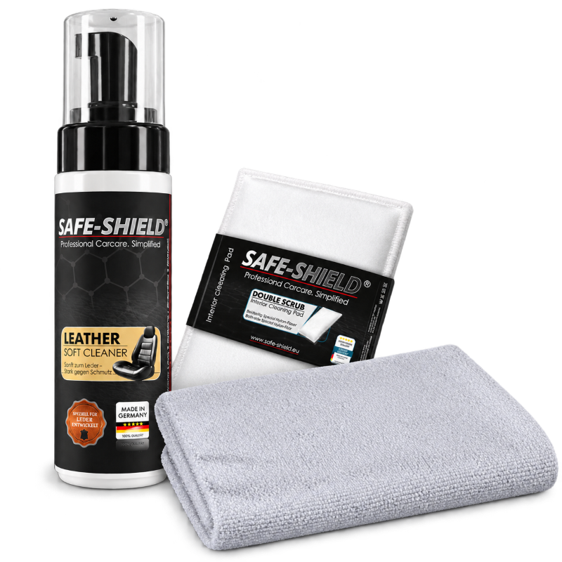 Safe-Shield Lederreinigungs-Set mit Leather Soft Cleaner, einem Double Scrub Pad und einem grauen, randlosen Mikrofasertuch.