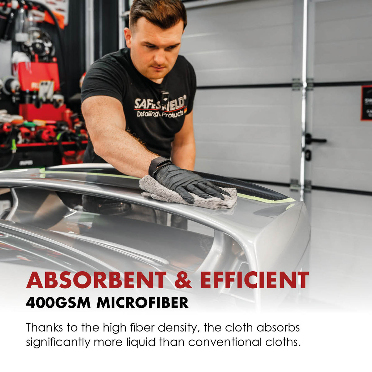 Safe-Shield 400 GSM microfibre cloth being used to wipe car paint.