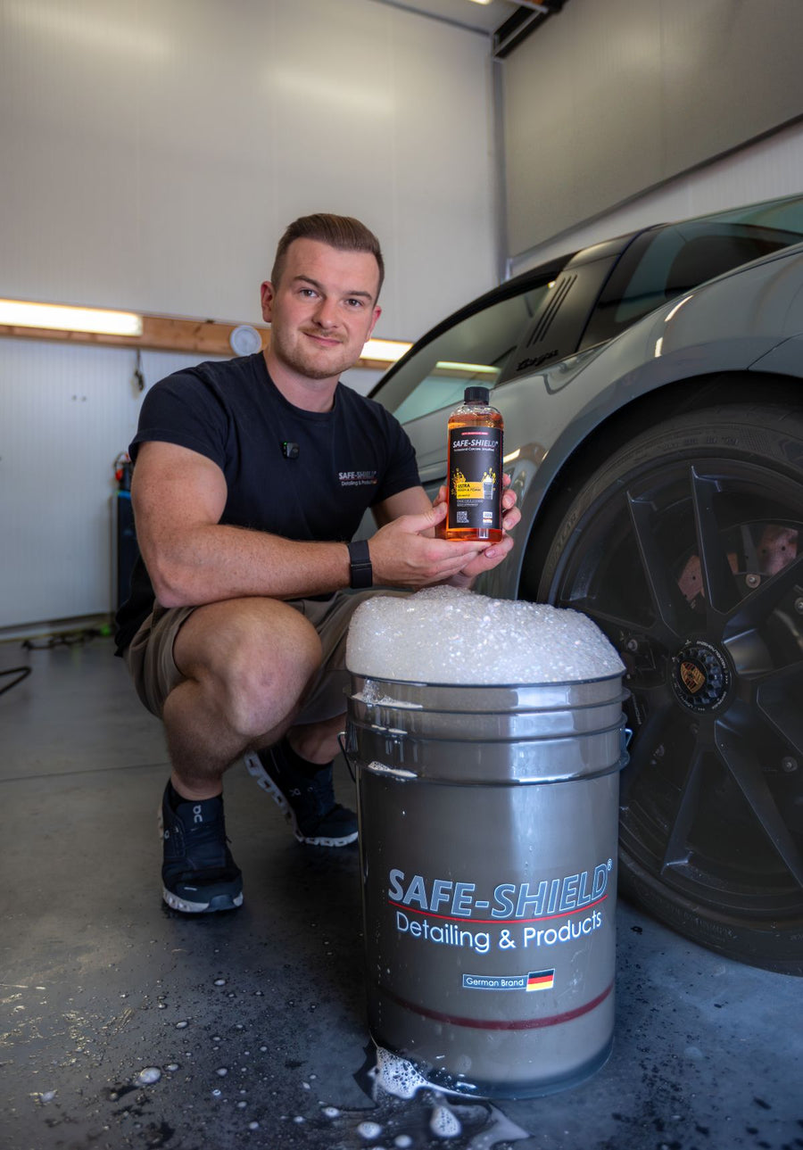 Tim Kohl, detailer and founder of Safe-Shield, holding a car care product